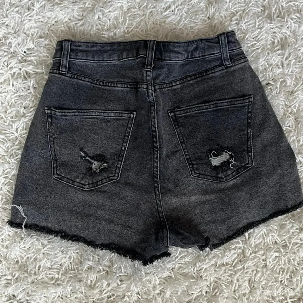 Black denim shorts with distressed